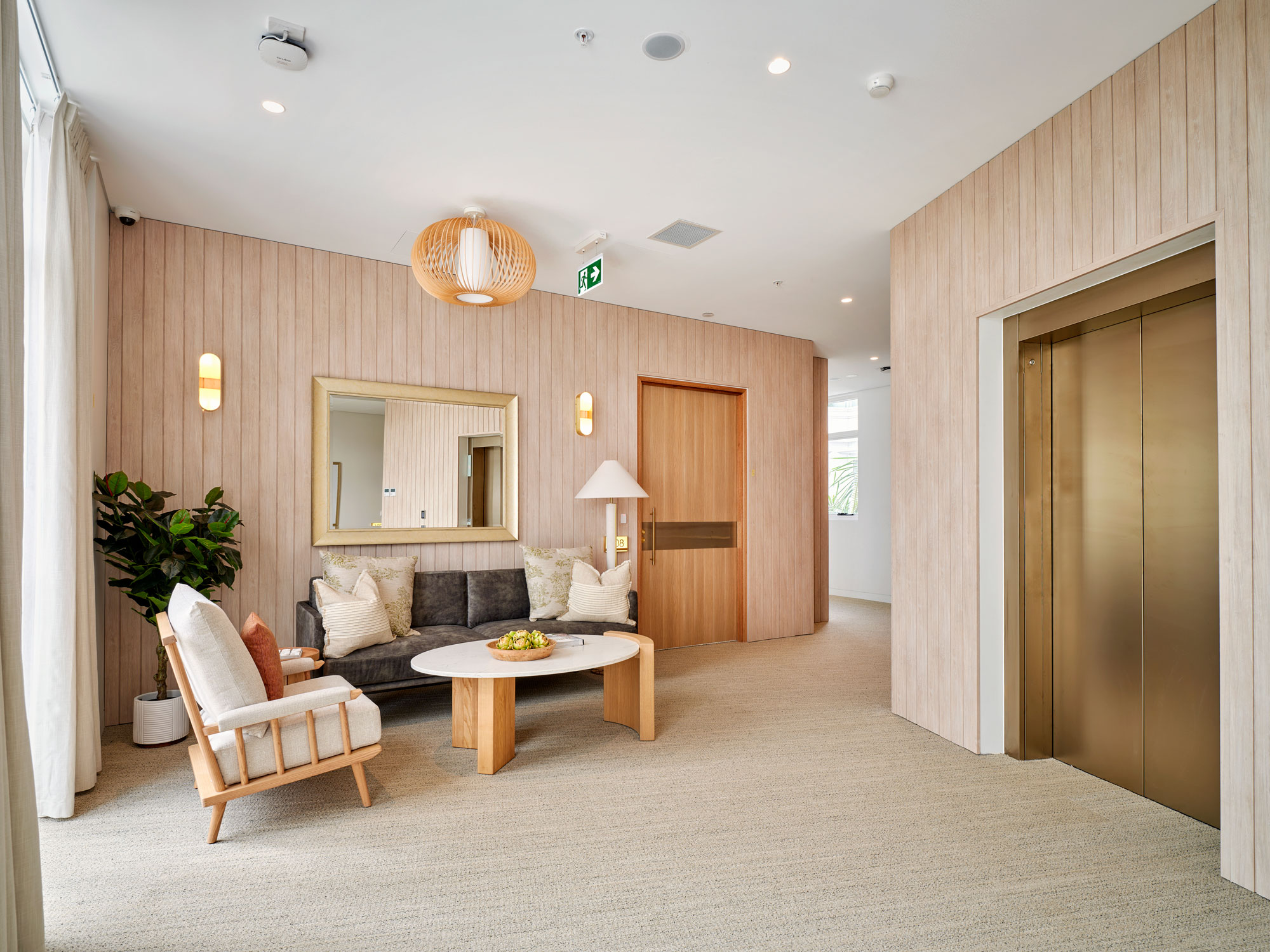 Seating and styling outside the elevator at Greenwich Place