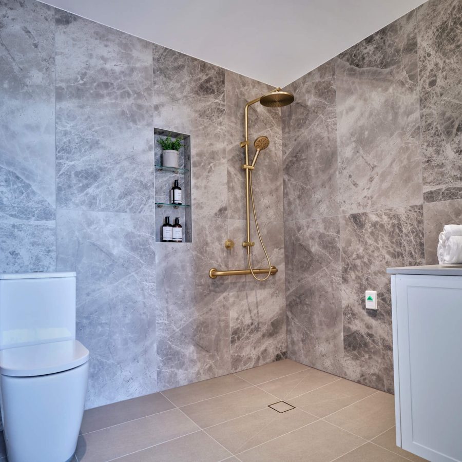 Greenwich Place Deluxe bathroom with toilet, shower and sink