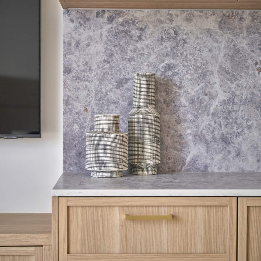 Greenwich Place Superior room kitchenette and television detail with vases