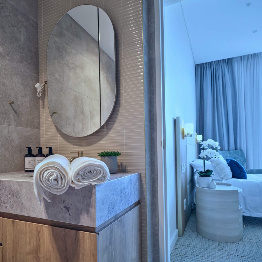 Greenwich Place bathroom and bedroom in background